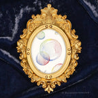 Rainbow Bubbles framed wall art by P. Pleasant Atelier with gold antique oval frame and Art Fairy Magic