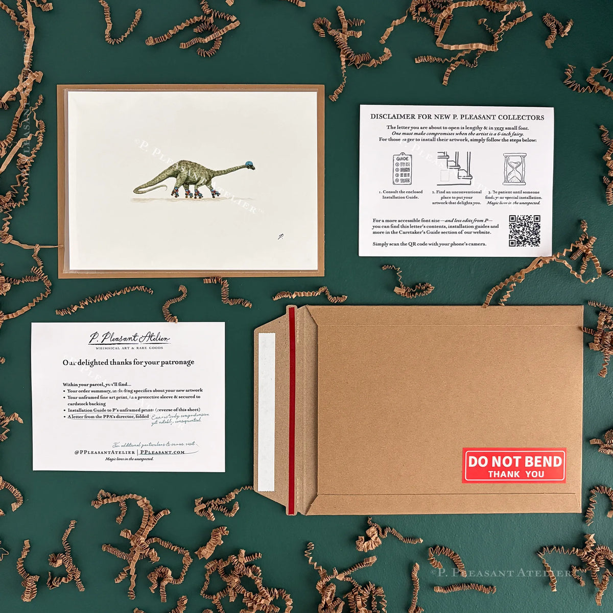 A framed dinosaur art print is displayed on a dark green textured background surrounded by brown shredded paper. Next to the frame is a brown kraft envelope with a red stripe, a white card with text, and a paper insert with a disclaimer for the 'P. Pleasant Collectors'.