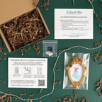 Art and Fairy Magic themed gift box with shredded paper filler, instruction sheet, and framed print in packaging