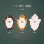 Three decorative shield-shaped picture frames shown on a dark green background with the text 'Frame Colors Shield' and labels 'Antique', 'Gold', and 'White'.