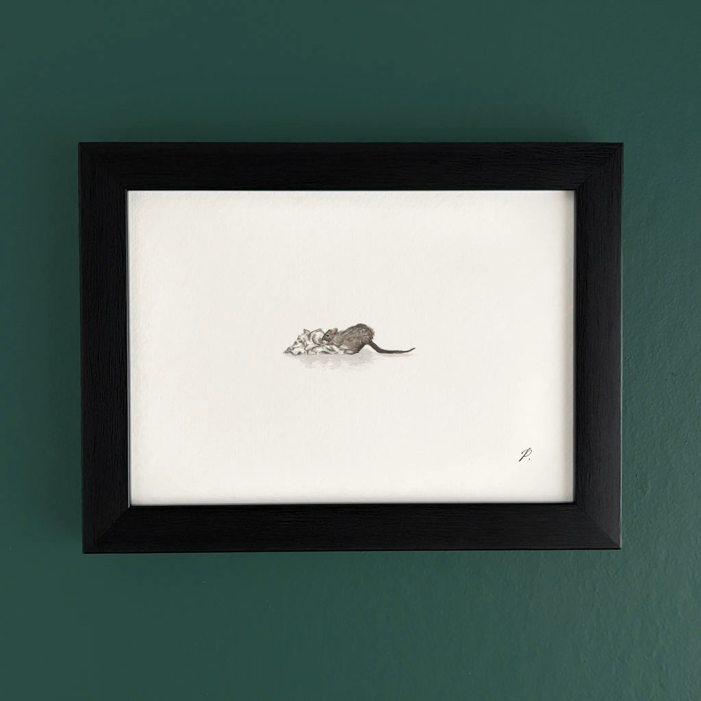 Art fairy magic illustration in a black frame on a teal wall, showing a small mouse near paper