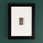 Art fairy magic illustration of a small house with windows, set in a dark wooden frame