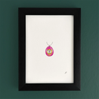 Art fairy magic pendant necklace with a pink teardrop charm and silver chain hanging in a dark frame
