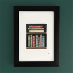 Art print in a black frame showing Magic and Fairy themed stacked books on a shelf