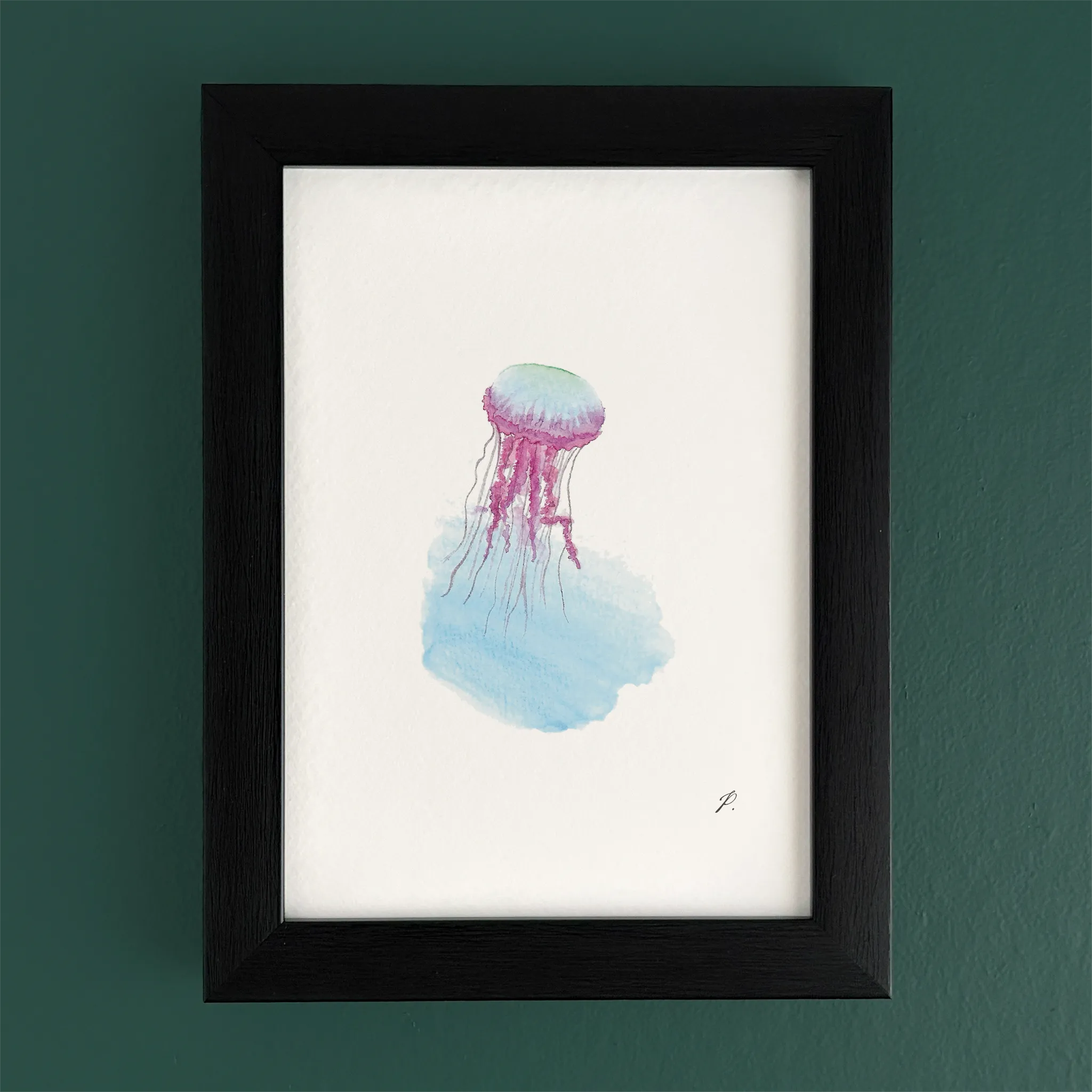 Art print in a black frame with a fairy jellyfish and flowing magic watercolor hues