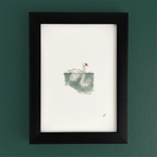 Art fairy magic illustration in a dark wooden frame, showing a swan floating on green water