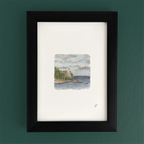 Art fairy magic theme watercolor landscape inside a dark wooden frame on a green wall
