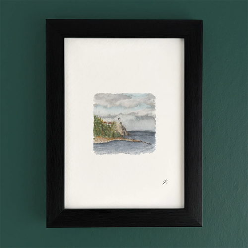Art fairy magic theme watercolor landscape inside a dark wooden frame on a green wall