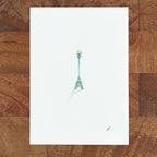 Art fairy magic illustration on a white card, showing a small wand-like figure in pale teal ink