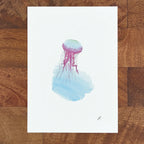 Art fairy magic illustration of a purple and blue jellyfish with watercolor tentacles on white paper