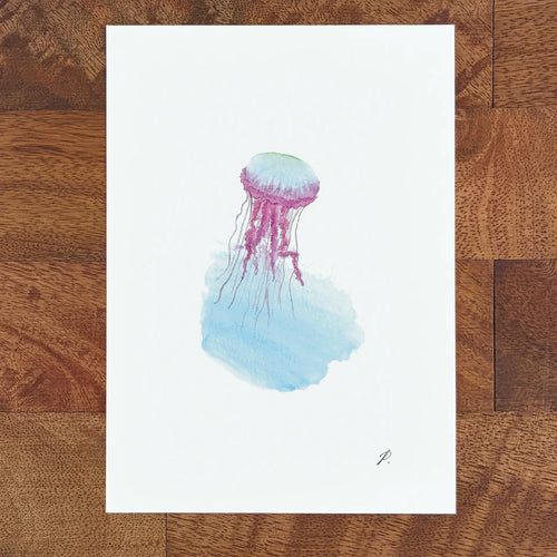 Art fairy magic illustration of a purple and blue jellyfish with watercolor tentacles on white paper